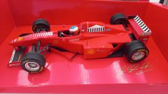 Minichamps Ferrari F310B M. Schumacher 1998 launch version 1/18, confezione lievemente usurata - foto 6
