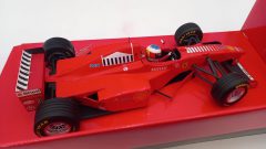 Minichamps Ferrari F310B M. Schumacher 1998 launch version 1/18, confezione lievemente usurata - foto 4