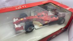 X.Q.Toys Ferrari 248 F1 radio comandata, completa di tutto, parti ingiallite, scatola rovinata, normali segni del tempo 1/10?
